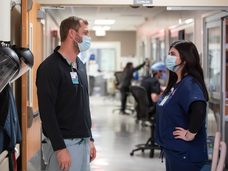 Medical Intensive Care Unit nurse manager Pate Shackelford talks with School of Nursing senior Abby May, who will join the MICU at UMMC after passing her licensing exam to become a registered nurse.