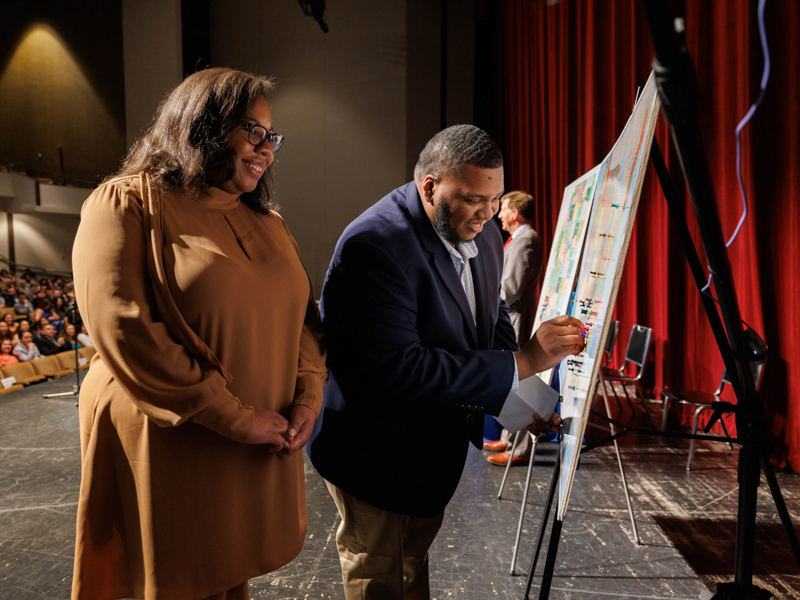 Waller puts a pin near Atlanta, Georgia, where he will complate residency at Emory University after graduation. His wife, Dr. Brianna Waller, joined him onstage at UMMC's Match Day event last month. Joe Ellis/ UMMC Communications