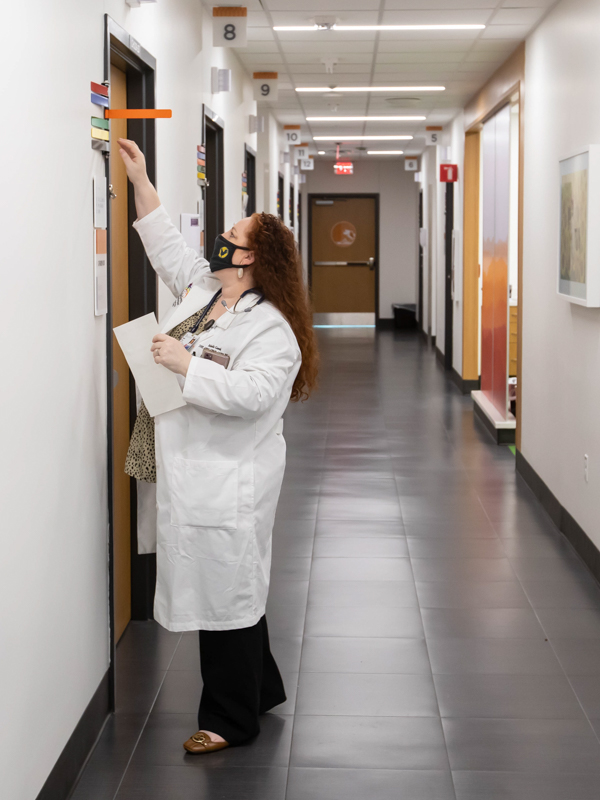 Goreth, an acute care pediatric nurse practitioner, prepares to see a patient at Children's of Mississippi's new weekly concussion clinic. Melanie Thortis/ UMMC Communications