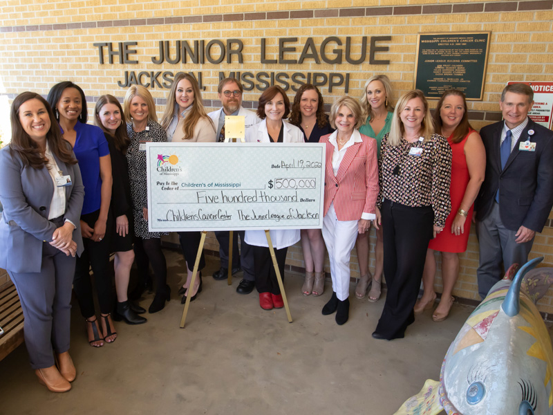 Celebrating a $500,000 gift from the Junior League of Jackson to the Center for Cancer and Blood Disorders at Children's of Mississippi are, from left, Suzanne Crell, UMMC major gifts officer; Shalon Wansley, JLJ training and organizational development vice president; Molly Griffin, JLJ Placement Chair; Meredith Aldridge, UMMC executive director of development and a JLJ past president; JLJ President Katie Lightsey Browning; Dr. Anderson Collier, director of the center and chief of pediatric hematology-oncology at the University of Mississippi Medical Center; Dr. Mary Taylor, Suzan B. Thames Chair and professor of pediatrics; JLJ President-elect Bethany Smith; Suzan Thames, a philanthropist and an early supporter of the center; JLJ Communications Vice President Kaitlyn Vassar; Melanie Hataway, UMMC operations and stewardship officer and a JLJ past president; Jane Harkins, UMMC planned giving officer and JLJ treasurer; and Children's of Mississippi CEO Guy Giesecke.