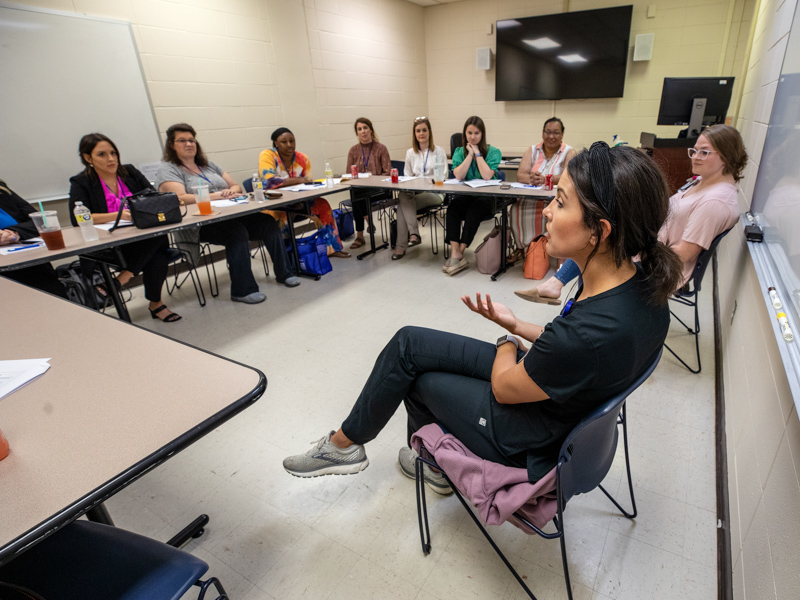 School of Nursing instructors Presly Lowry, center, and Rachel Gambill, right, prepare Bower scholars for the start of their MSN studies at UMMC.