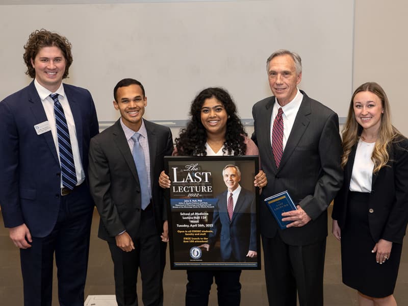 Hall, second from right, stands with members of the Student Alumni Representatives. From left, they are medical students Luke Wojohn, John Whitaker and Monica Kala, and graduate student Casey Boothe.