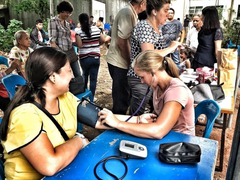 In this file photo, Mallory Archer is shown taking vital signs during a mission trip to the Philippines.