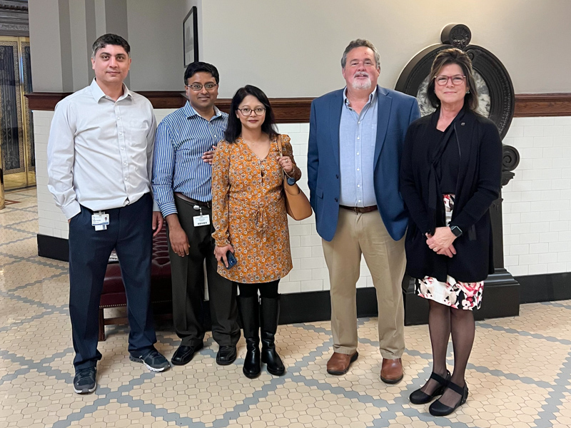 The SOPH's Health Policy Fellowship trains students, residents and faculty about Mississippi's legislative process and how to affect policy in the state. Shown during a March visit to the Mississippi Capitol in March, the 2022 fellows included Dr. Ali Dehghani Firouzabadi, Dr. Ravi Janumpally and Dr. Nusrat Kabir, preventive medicine residents; Mitchell Adcock, executive director of the Center for Mississippi Health Policy; and Kelli Irby, master's student in population health science.