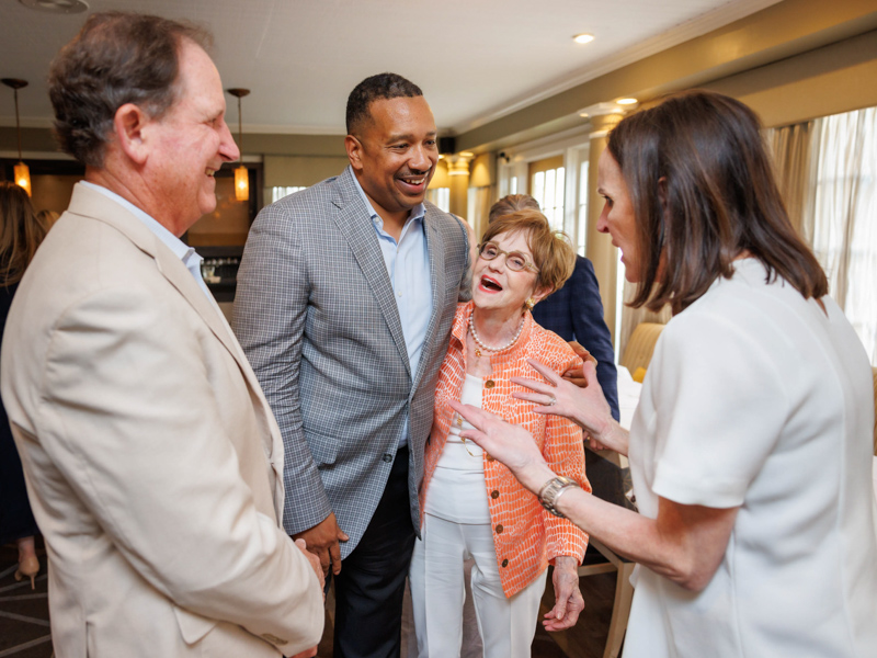 Campaign for Children's of Mississippi supporters Hoppy Cole, left, and Jerome Brown share a laugh with campaign chair Kathy Sanderson and her daughter, Katy Sanderson Creath. Joe Ellis/ UMMC Communications 