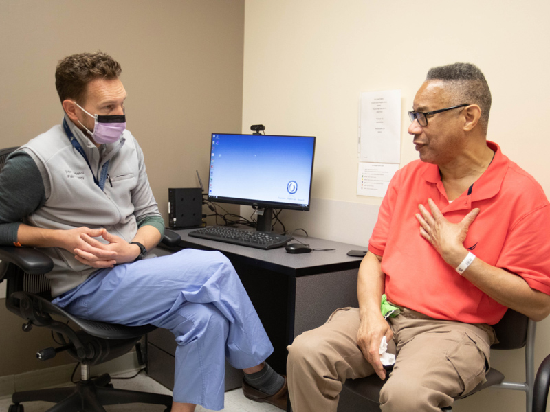 David Young, right, discusses his breathing challenges with Dr. Michal Senitko.  Melanie Thortis/ UMMC Communications 