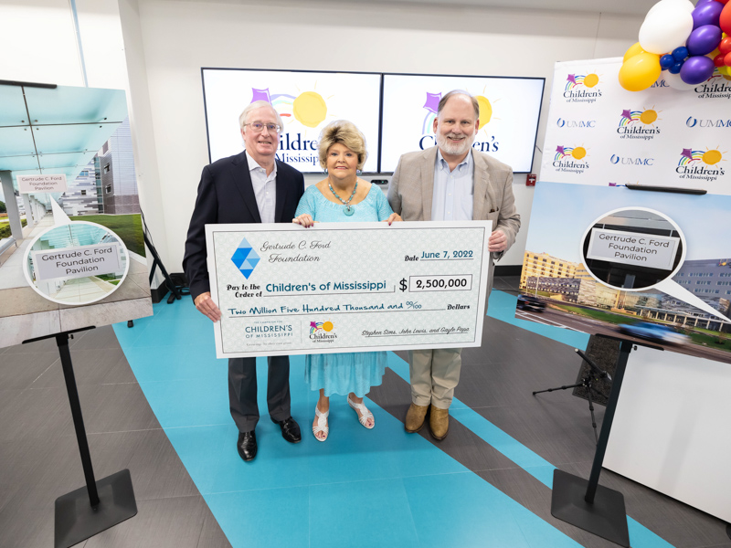 Gertrude C. Ford Foundation director Stephen Sims, left, president Cheryle Sims and vice president and treasurer John Lewis present a $2.5 million donation to the Campaign for Children's of Mississippi. Melanie Thortis/ UMMC Communications 