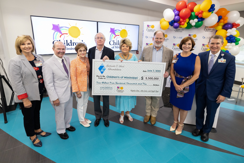 Celebrating the $2.5 million donation from the Gertrude C. Ford Foundation that helped push the Campaign for Children's of Mississippi to $101.5 million are, from left, Dr. LouAnn Woodward, vice chancellor for health affairs and dean of the School of Medicine; Joe F. Sanderson, CEO and board chairman of Sanderson Farms and, with wife Kathy Sanderson, chair of the Campaign for Children's of Mississippi; Stephen Sims, director of the Gertrude C. Ford Foundation; Cheryle Sims, president of the Gertrude C. Ford Foundation; John Lewis, vice president and treasurer of the Gertrude C. Ford Foundation; Dr. Mary Taylor, Suzan B. Thames Chair and professor of pediatrics; and Children's of Mississippi CEO Guy Giesecke. Melanie Thortis/ UMMC Communications 