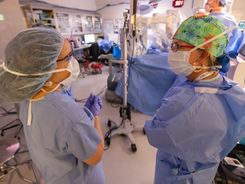 Medical student Jessica McKenzie, left, shadows Dr. Mildred Ridgway, associate professor of obstetrics and gynecology, during a surgical procedure at Wiser Hospital.