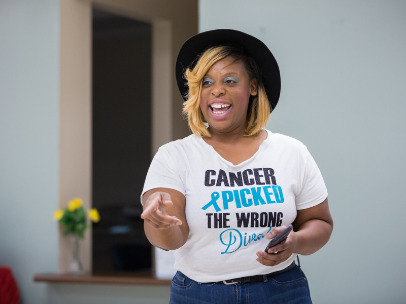 Tomeka Harps of Brandon, whose cancer was discovered at the 2017 See, Test and Treat congratulates a group of women for coming and offers encouragement. 