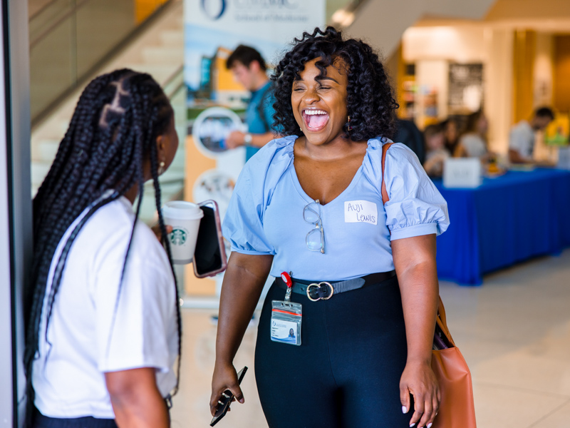 Second-year medical student Haley Williams, left, greets first-year student Auji Lewis during Welcome Week for School of Medicine students.