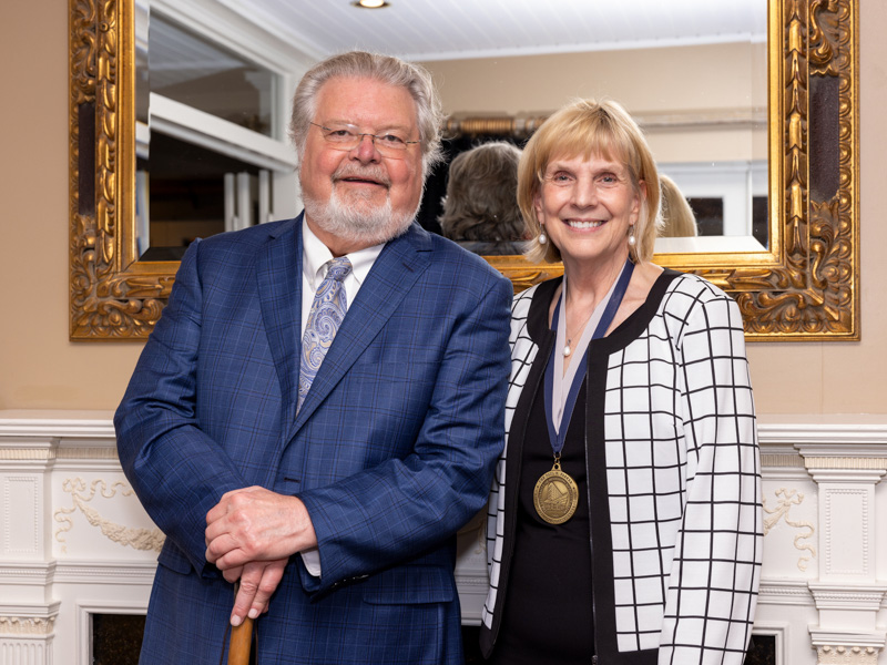 Dr. Paul Parker smiles with Dr. Phyllis Bishop after the presentation of the Paul Parker Chair of Pediatric Gastroenterology. Jay Ferchaud/ UMMC Communications