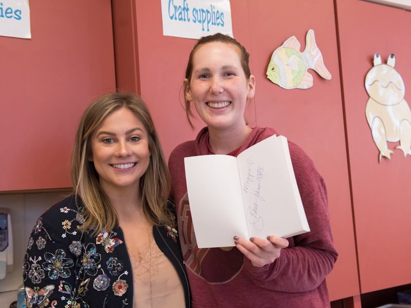 In this file photo, Olympic gold medalist and author Shawn Johnson East smiles with Maggie Hanberry during a children's hospital visit.