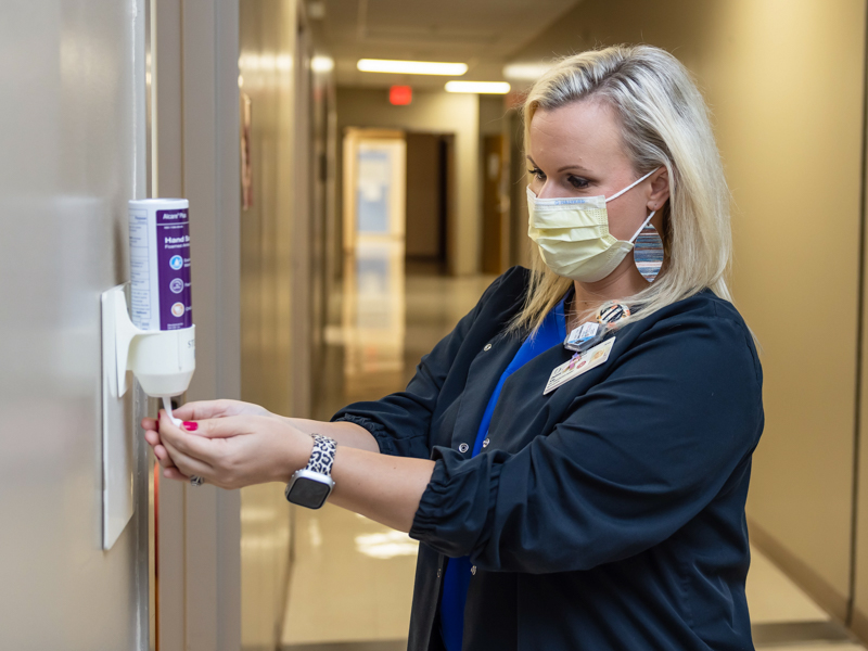 Diagnostic Sonographer-Mammographer Chelsea Trim foams up before entering a patient room as part of front line providers’ efforts to keep patients safe at the Medical Center. Melanie Thortis/ UMMC Communications