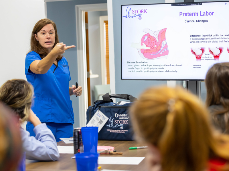 Dr. Rachael Morris, associate professor in the Department of Obstetrics and Gynecology, discusses cervical changes in preterm labor with Lackey Memorial Hospital emergency room staff. Melanie Thortis/ UMMC Communications