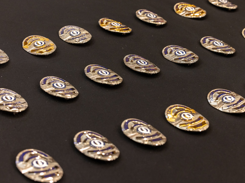The badges belonging to the Medical Center's police and security officers were blessed Sept. 1 during a ceremony in the University Hospital chapel. Jay Ferchaud/ UMMC Communications