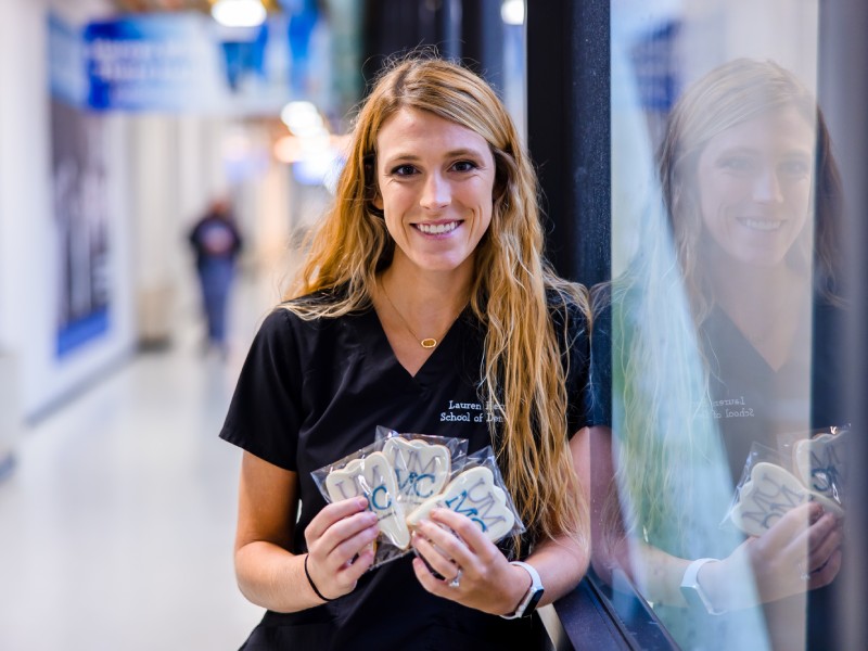 Fourth-year School of Dentistry student Lauren Thames baked and iced 250 tooth-shaped cookies to give out to faculty, staff and students August 24 as a show of love from the SOD. Lindsay McMurtray/ UMMC Communications