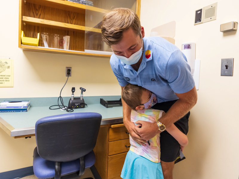 2021 Sanderson Farms Championship winner Sam Burns gets a hug from Children's of Mississippi patient Mary Mosley Pickering of Philadelphia.