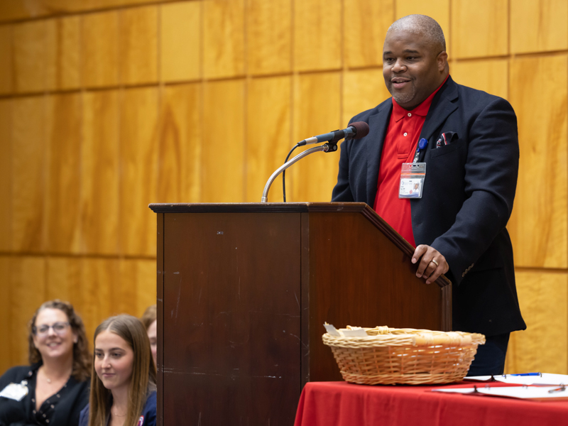 Dr.Derek Holt, assistant professor and director of family nurse practitioner track, speaks during the School of Nursing Class of 2024 white coat ceremony. Melanie Thortis/ UMMC Communications 