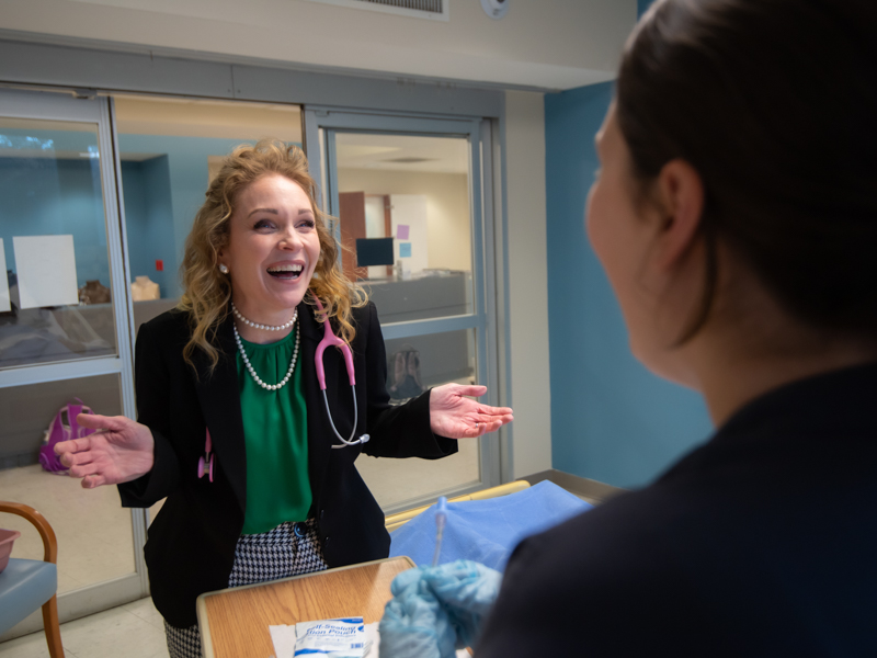 Holley talks with an accelerated BSN student.  Photo by Kevin Bain/The University of Mississippi Marketing Communications