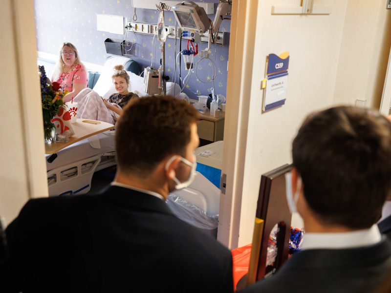 Children's of Mississippi patient Mia Letchworth and her mother, Debbie Turnage of Bogue Chitto, get a visit from the Ole Miss baseball team and their College World Series trophy. Joe Ellis/ UMMC Communications