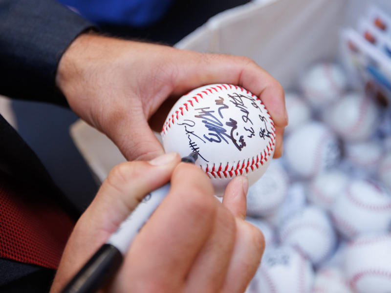 Members of the College World Series-winning Ole Miss baseball team signed dozens of baseballs for Children's of Mississippi patients. Joe Ellis/ UMMC Communications 