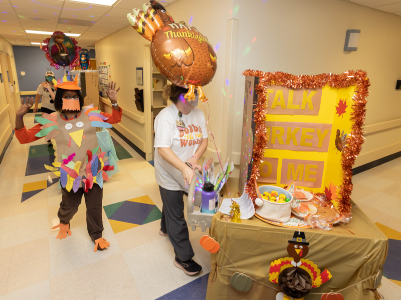 The Children's of Mississippi Thanksgiving Parade winds through the hallways of the Batson Tower's inpatient floors. Pictured are Michelle Chambers, left, and Ashley Prendez. Melanie Thortis/ UMMC Communications 