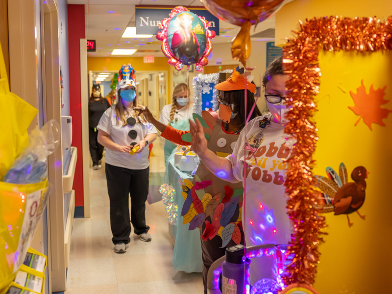Children's of Mississippi's child life team wave to patients during the hospital's annual Thanksgiving Parade. From left are Courtney Easterday, Anne Elizabeth Zegel, Michelle Chambers and Ashley Prendez. Melanie Thortis/ UMMC Communications 