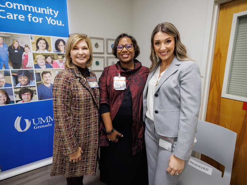 Among those gathered Nov. 29 for an open house for UMMC Grenada's student living space were, from left, UMMC Vice Chancellor and School of Medicine Dean Dr. LouAnn Woodward; Dr. Loretta Jackson-Williams, School of Medicine vice dean; and Judi Beth Stephens, a third-year medical student. Joe Ellis/ UMMC Communications