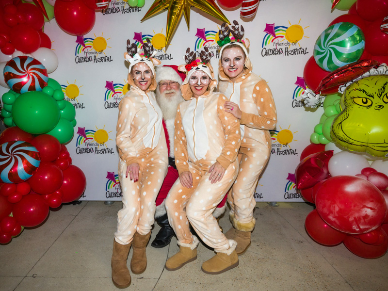 Santa smiles with his reindeer for a photo during BankPlus Presents Light-A-Light. Joe Ellis/ UMMC Communications 