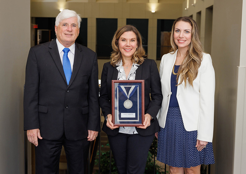 Platinum award recipient Dr. Caroline Compretta, center, with Dr. Joey Granger, left, and Dr. Leslie Musshafen.