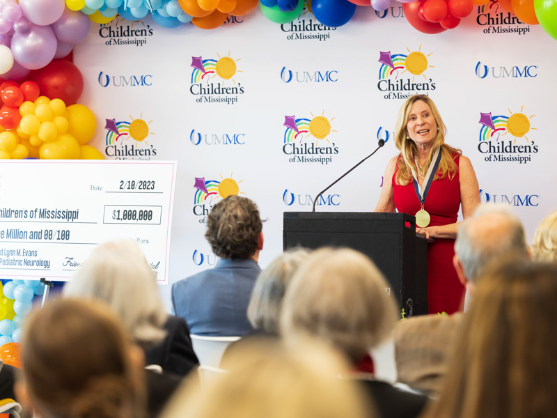 Dr. Colette Parker shares memories after being presented with the Dr. Owen B. and Lynn M. Evans Chair of Pediatric Neurology.