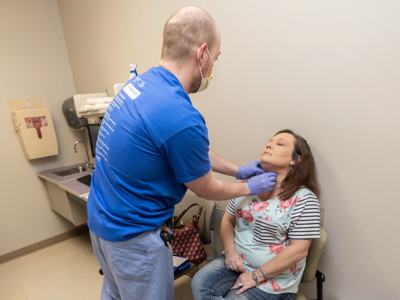 Patient Candace Greer is examined by Dr. Matthew Russ during the See, Test & Treat event held at the Jackson Medical Mall Saturday.