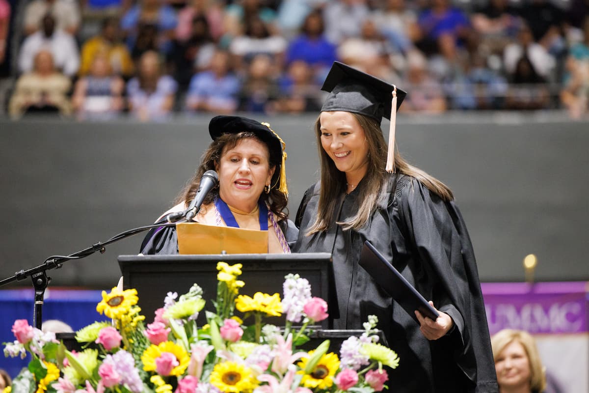 Dr. Julie Sanford presents Sarah Elisabeth Vaughan with the Richard N. Graves Award.