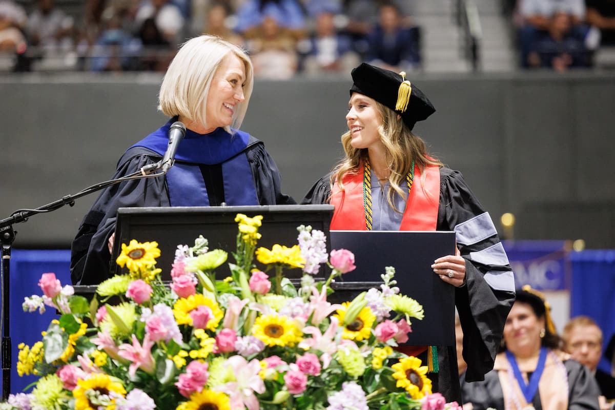 Taylor Johnson, right, receives the Dr. Virginia Stansel Tolbert award.