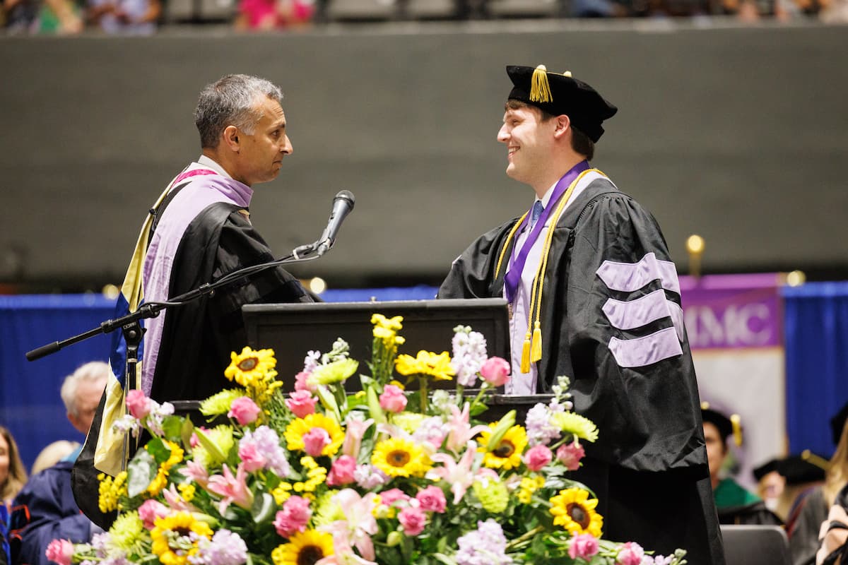 Dr. Sreenivas Koka presents Andrew Burnham with the Wallace V. Mann Jr. Award.