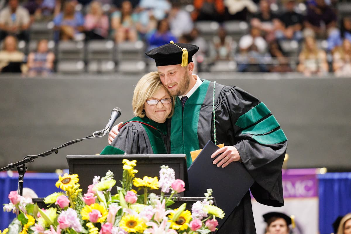 Dr. LouAnn Woodward presents John Dumas with the Waller S. Leathers Award.