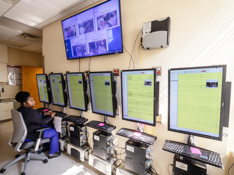 Yvette McClendon, a neurodiagnostic assistant in the Epilepsy Monitoring Unit, watches the EEG readings of patients as she views them via cameras in their rooms.