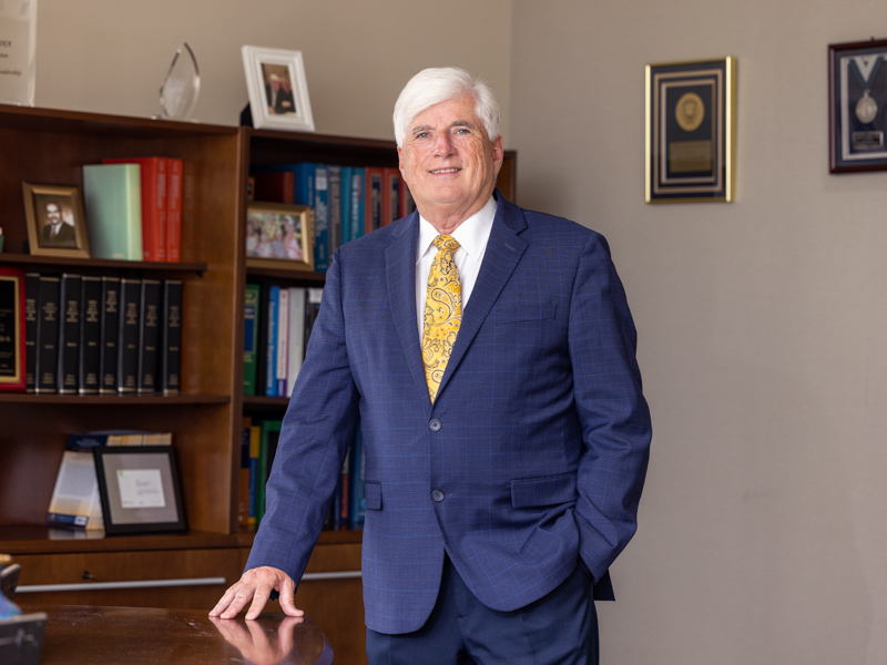 Granger poses for his final official portrait as associate vice chancellor for research and SGSHS dean, among other roles. Jay Ferchaud/ UMMC Communications