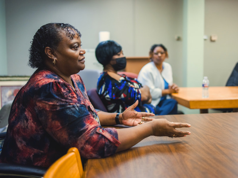 LeToya Donelson, an OR scheduler, shares her thoughts during a rounding session with hospital executives. LM 