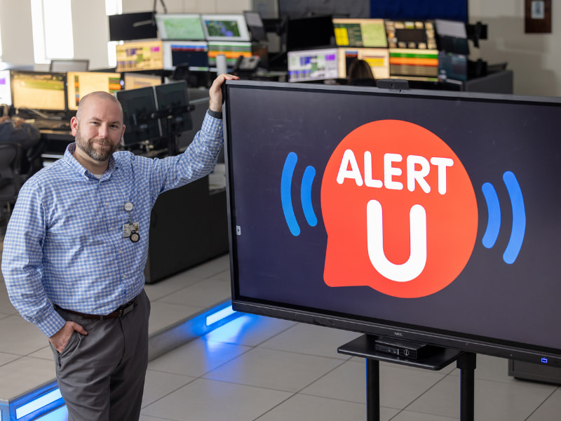 Stephen Houck, director of the Mississippi Center for Emergency Services, with the Alert U logo.