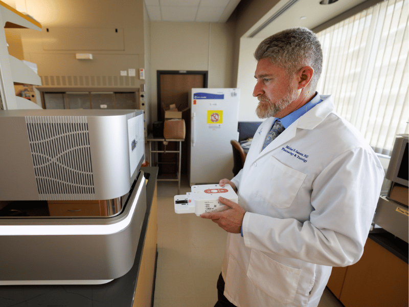 Researchers received 311 grants and awards last fiscal year that will add to the Medical Center’s discovery enterprise in areas including addiction, telehealth, violence prevention and perinatal disease. Pictured is Dr. Michael Garrett in the Molecular and Genomics Core Facility that will serve as the 