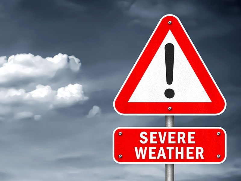 Photo illustration of severe weather sky with Road sign for Severe Weather