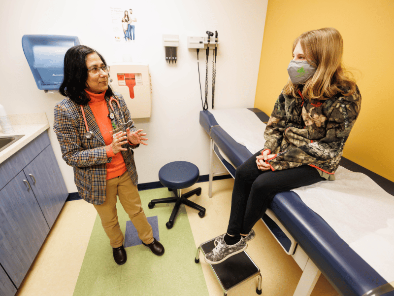 Nephrologist Dr. Sabahat Afshan talks with kidney transplant patient Dakota White during a follow up visit. White has been waiting for a transplant since 2022.