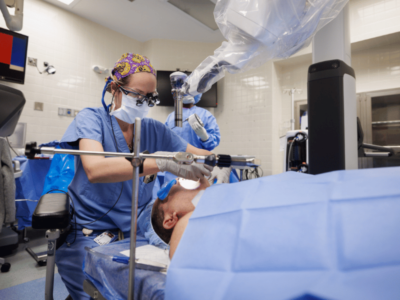 Head and Neck Cancer specialist and surgeon, Dr. Anne Kane, prepares patient Todd Wilson for one of the first single port robot-assisted surgeries in the state of Mississippi.