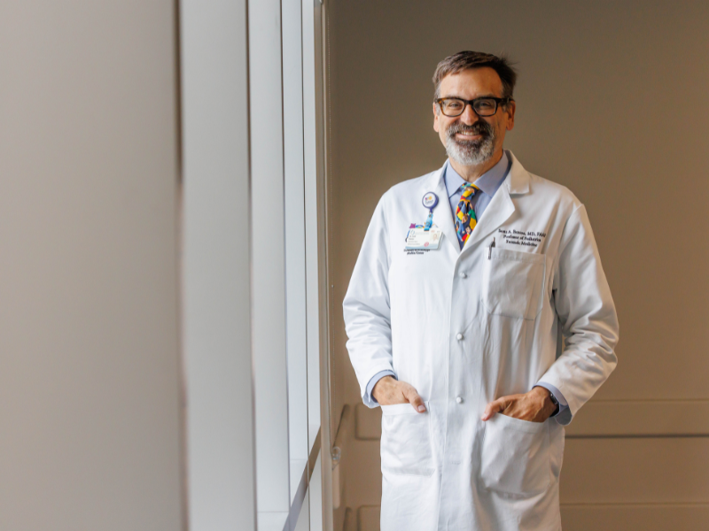 Dr. Scott Benton, director of the Division of Forensic Medicine at the University of Mississippi Medical Center and medical director of the Children’s Safe Center, holds the Award for Outstanding Service to Maltreated Children from the AAP Council on Child Abuse and Neglect.