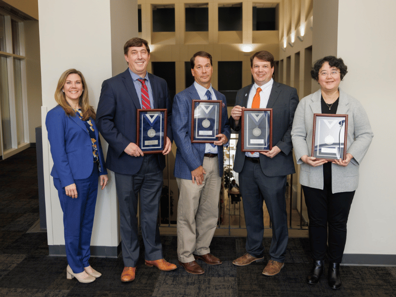 Platinum award recipients, from second left to right, are Dr. Michael Hall, Dr. David Stec, Dr. Gene Bidwell and Dr. Hong Zhu.