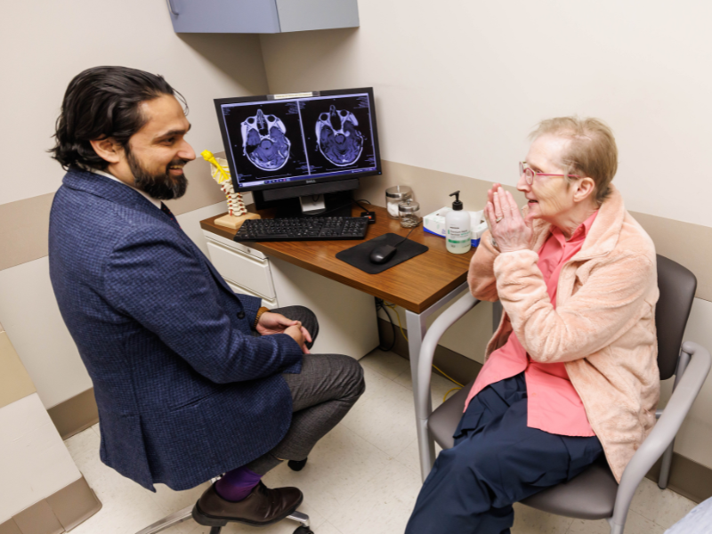 Georgia Pritchard of Sturgis in a follow-up visit has a conversation with Dr. Omar Chohan, associate professor of neurosurgery, after receiving laser interstitial thermal therapy for her persistent brain tumor.