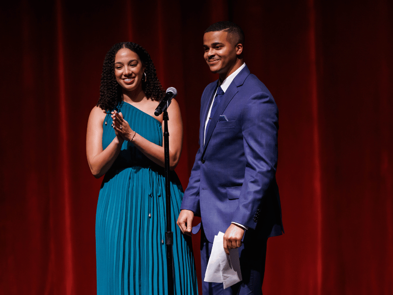 Medical student Eric Lucas and his fiancee, Marissa Anderson, smile during his Match Day announcement. Melanie Thortis/ UMMC Photography