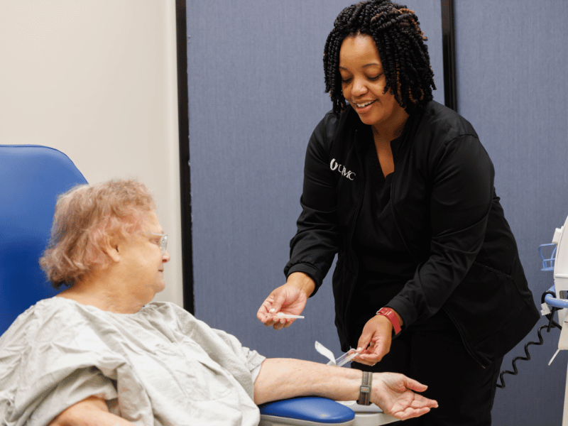 Registered Nurse Sheakitra Hodge attends to patient Judy Barnes at the Pain Management Clinic at the Jackson Medical Mall. "Everybody I've ever come in contact with at UMMC is wonderful and has a caring attitude," Barnes said. "It's impressive." Melanie Thortis/ UMMC Communications